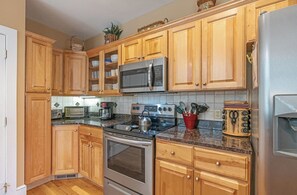 Dishwasher, coffee/tea maker, cookware/dishes/utensils, dining tables