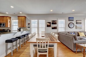 Enjoy a spacious living area with a kitchen, dining space, and comfortable seating for relaxation.