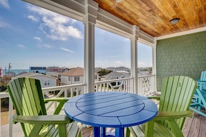 Enjoy al fresco dining with a view of the surrounding houses from this outdoor seating area.