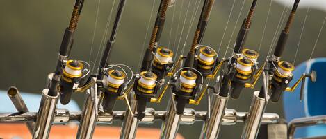 A fishing rod rack with multiple fishing rods.