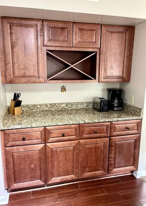 Enjoy cooking in this well-equipped kitchen with an oven, coffee maker, and knife block.