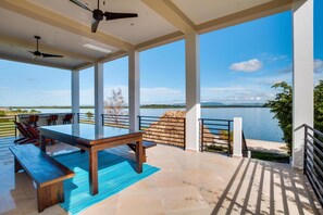 Outdoor dining - Luxury 3-Story Waterfront Villa with Pool (Placencia)