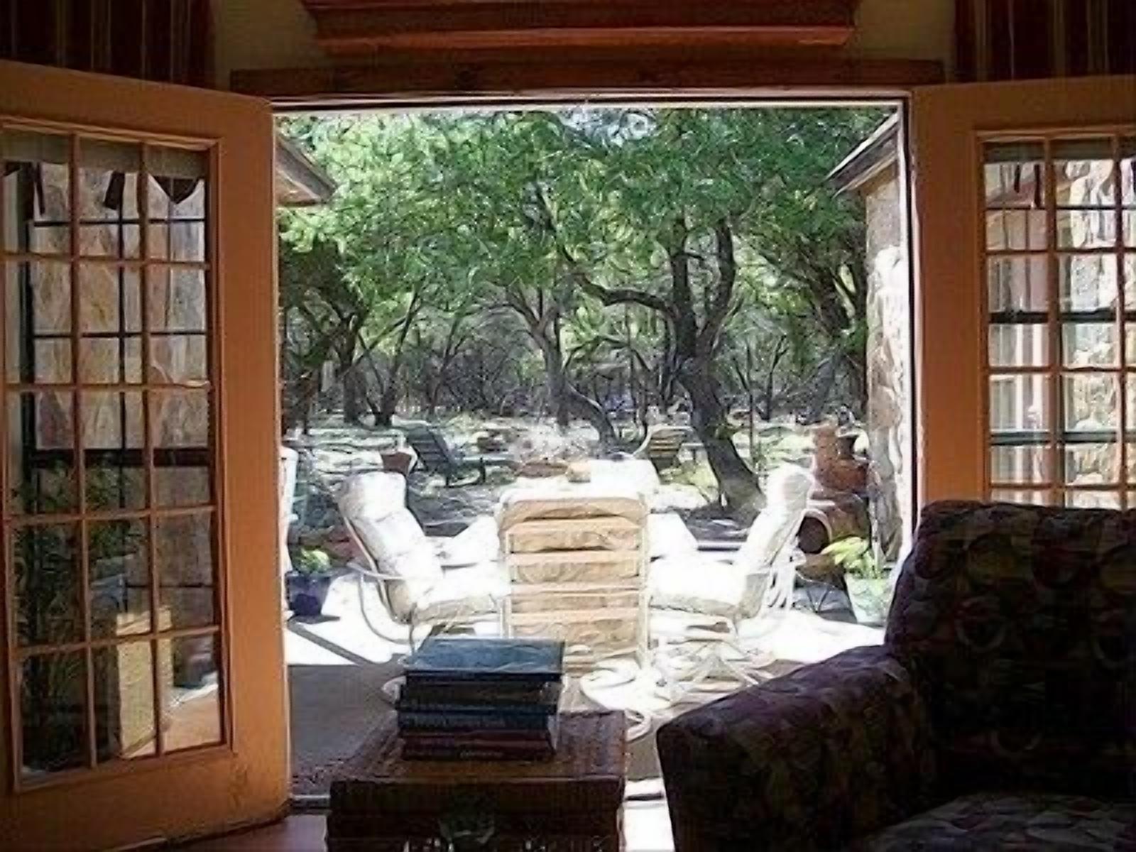 French Doors Open to patio and grounds adjacent to Shield Ranch Preserve. 
