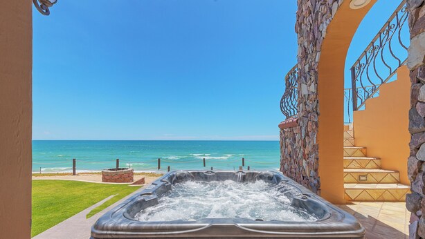 A hot tub with a view of the ocean, stone walls, and a staircase. - Villa #18:  LUXURY 5 Bed/5 bath Oceanfront home for 14 guests.  Renovated 3/26. (Puerto Peñasco)