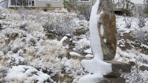 A house with a covered porch and a snow-covered rock formation in front. - Terlingua Ranch Retreat: Enviro Friendly Home (Terlingua)