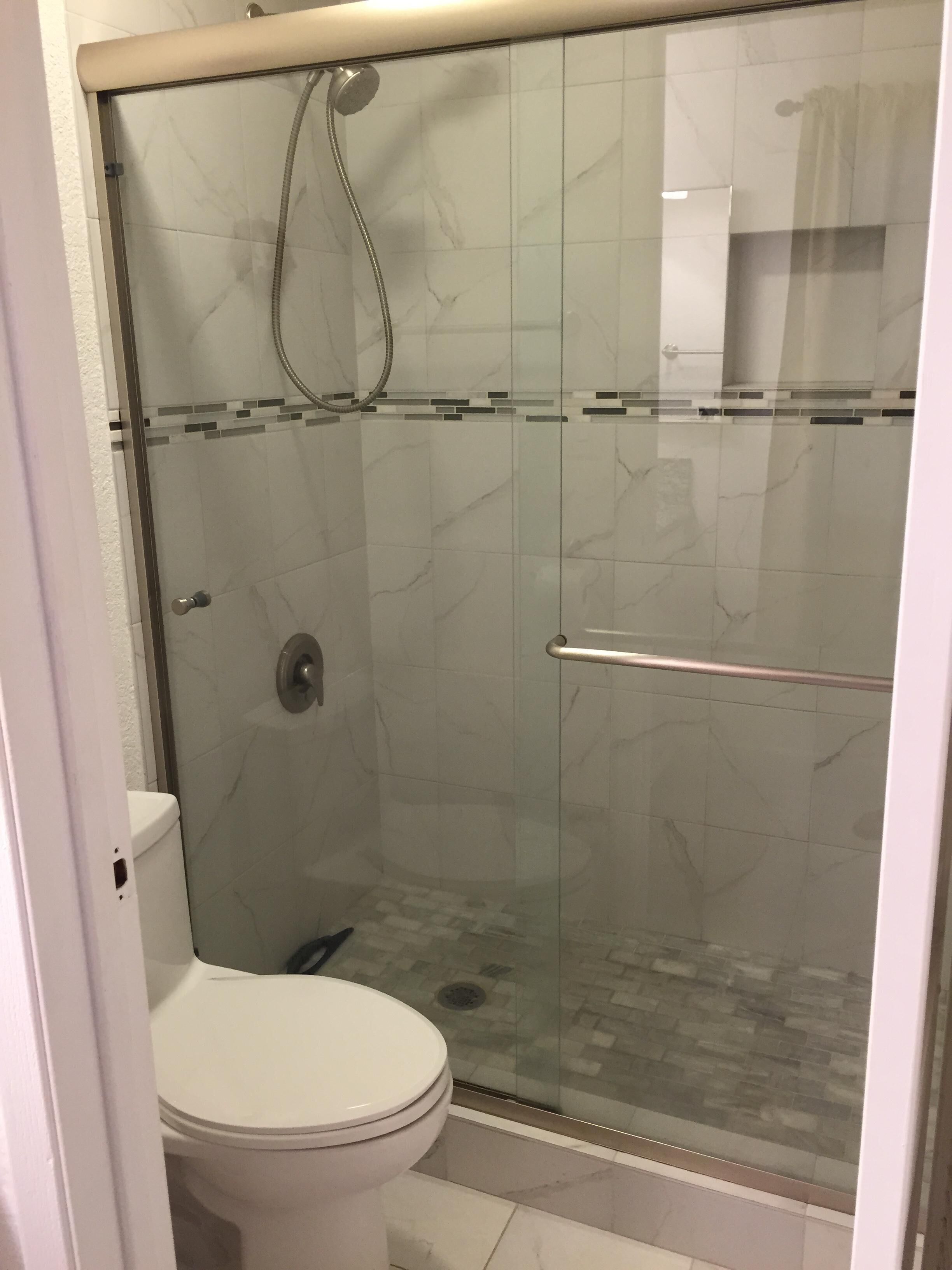 Combined shower/tub, hair dryer, towels, soap