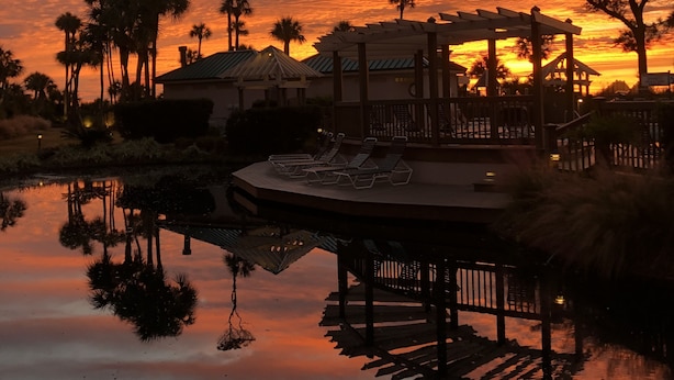 A resort with a pool, lounge chairs, and a gazebo. - Oceanfront - Very Comfortable - Windsor Court (Hilton Head Island)
