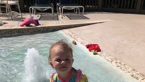 A child playing in a pool with water jets. - Oceanfront - Very Comfortable - Windsor Court (Hilton Head Island)