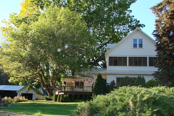 Built in 1908 here's a summer view -surrounded by Ash, Black Walnut & evergreens
