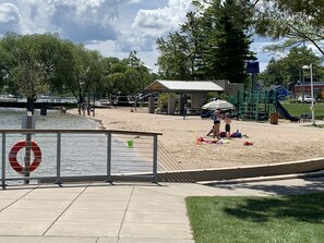 Enjoy a serene beachside escape with a playground, pavilion, and lush greenery.