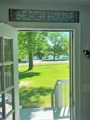 Step outside to the beach house's lawn and enjoy the serene views of the water.