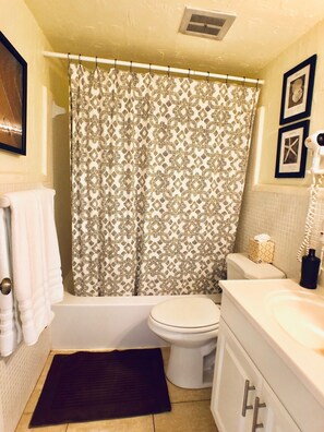 Combined shower/bathtub, hair dryer, towels, soap