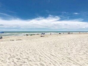 On the beach, sun-loungers, beach towels