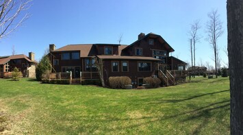Spring time view of the Clubhome unit from the back yard (9th fairway).