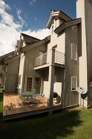 Back decks. With table and grill. 