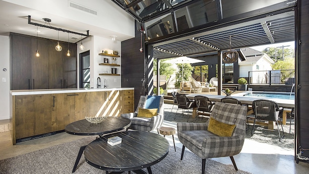 A modern kitchen with dark wood cabinets, a central island, and pendant lighting.