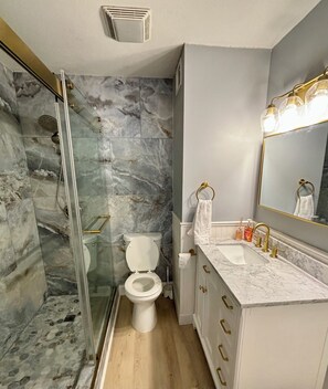 Combined shower/tub, hair dryer, towels, soap