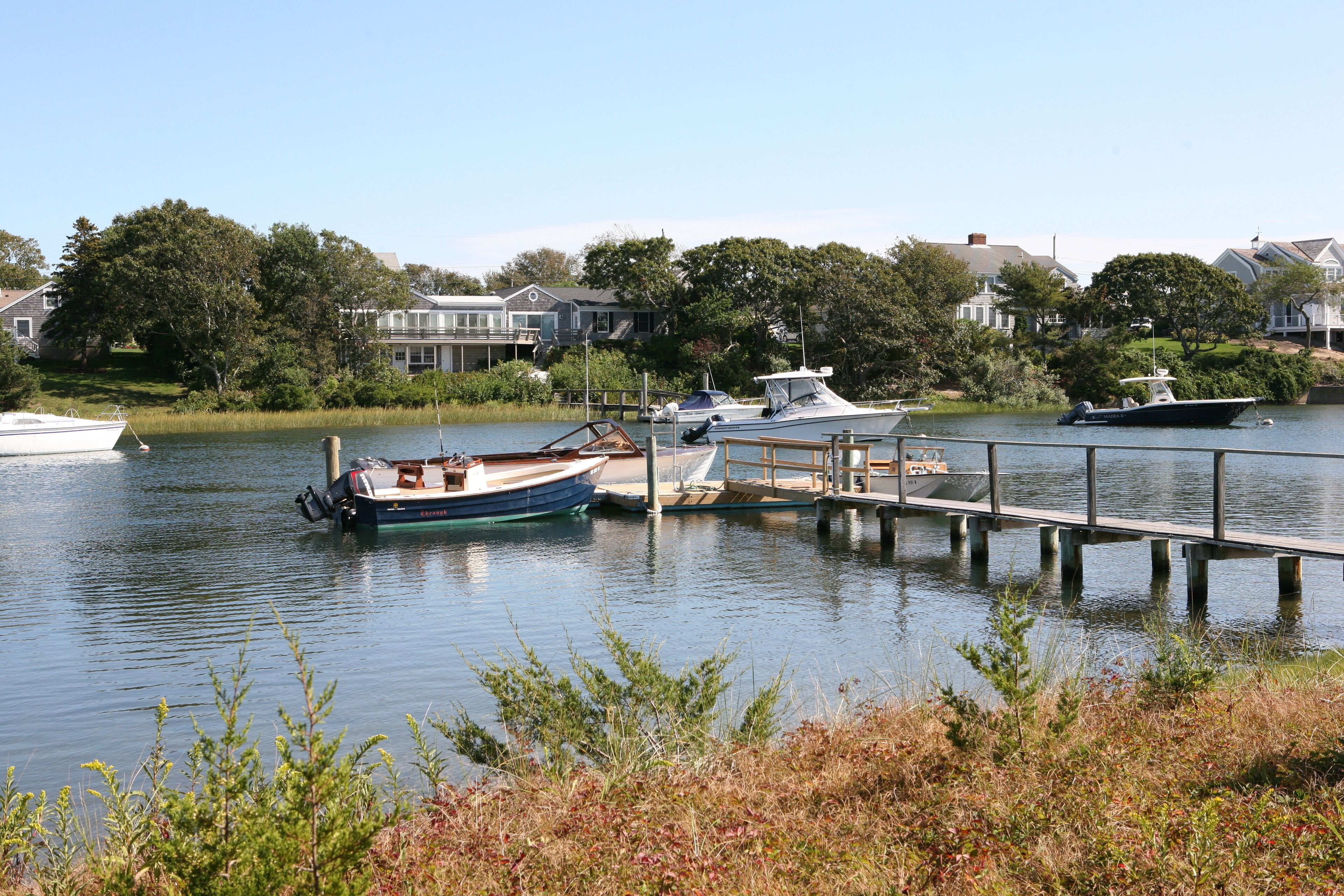 River front with deep water dock and quick access to Nantucket Sound. 