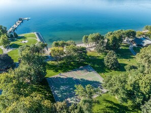 Enjoy serene lakeside recreation with a basketball court, dock, and walking paths.