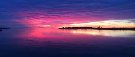 On the beach, sun-loungers