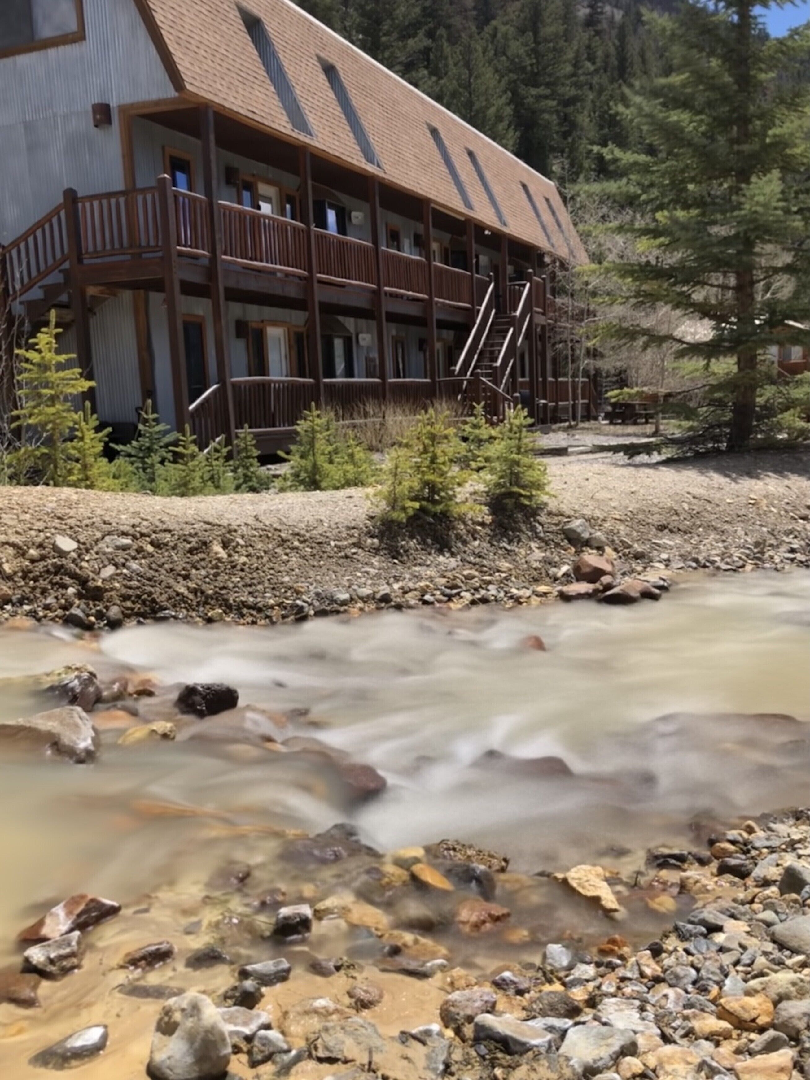 Slumgillion Creek tumbles alongside the condo building.