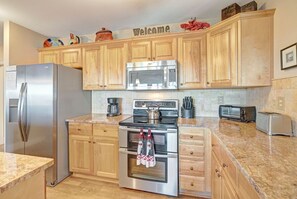 Dishwasher, coffee/tea maker, cookware/dishes/utensils, dining tables