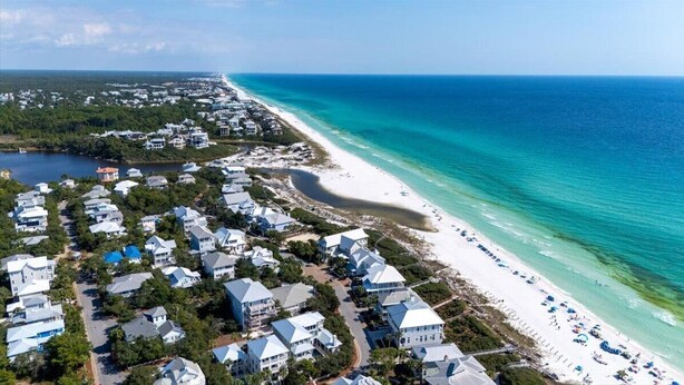 An aerial view of a coastal residential area with houses and a beach. - South of 30A, Pet friendly home w/Heated Pool, Golf cart or walk to beach (Santa Rosa Beach)