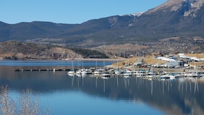 A marina with boats docked, surrounded by mountains and a clear sky. - New 3BR/3BA & Loft, Private Hot Tub, Heated Pool, Views, Walk/Bus to River Run (Keystone)