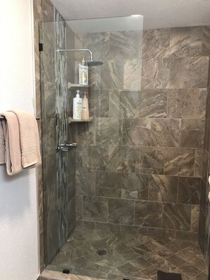 Hair dryer, towels, shampoo, toilet paper