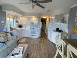 Well stocked kitchen with small safe to lock valuables while at the beach/oool