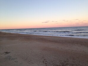 A beach with a clear sky and calm sea. - Ocean Views! Private Pool! Hot Tub Open All Year! (Kitty Hawk)