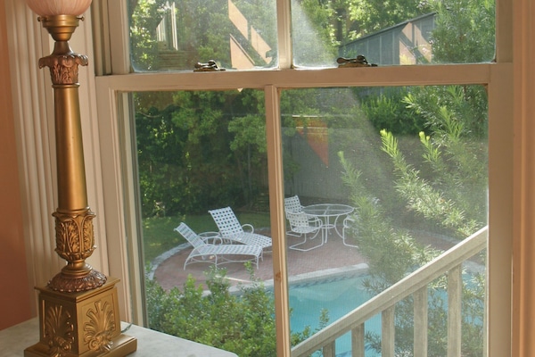 The pool garden is right next to the Carriage House
