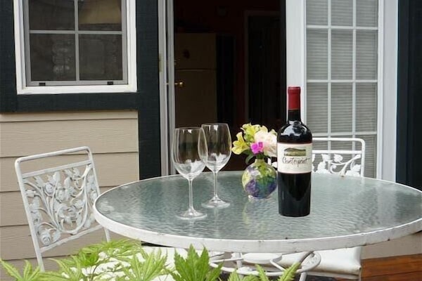 Charming outdoor attached private deck for morning coffee or evening dining.