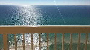 A balcony with a view of the ocean.