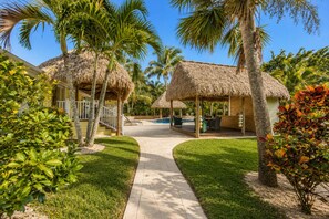 Terrace/patio - Private Tropical Farm Escape — Tiki Hut Pool & Hot Tub - Pet Friendly Stay! (Jupiter)