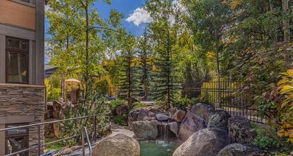 Seconds to mall and slope, 2 hot tubs,1 pool, small gym, fireplaces