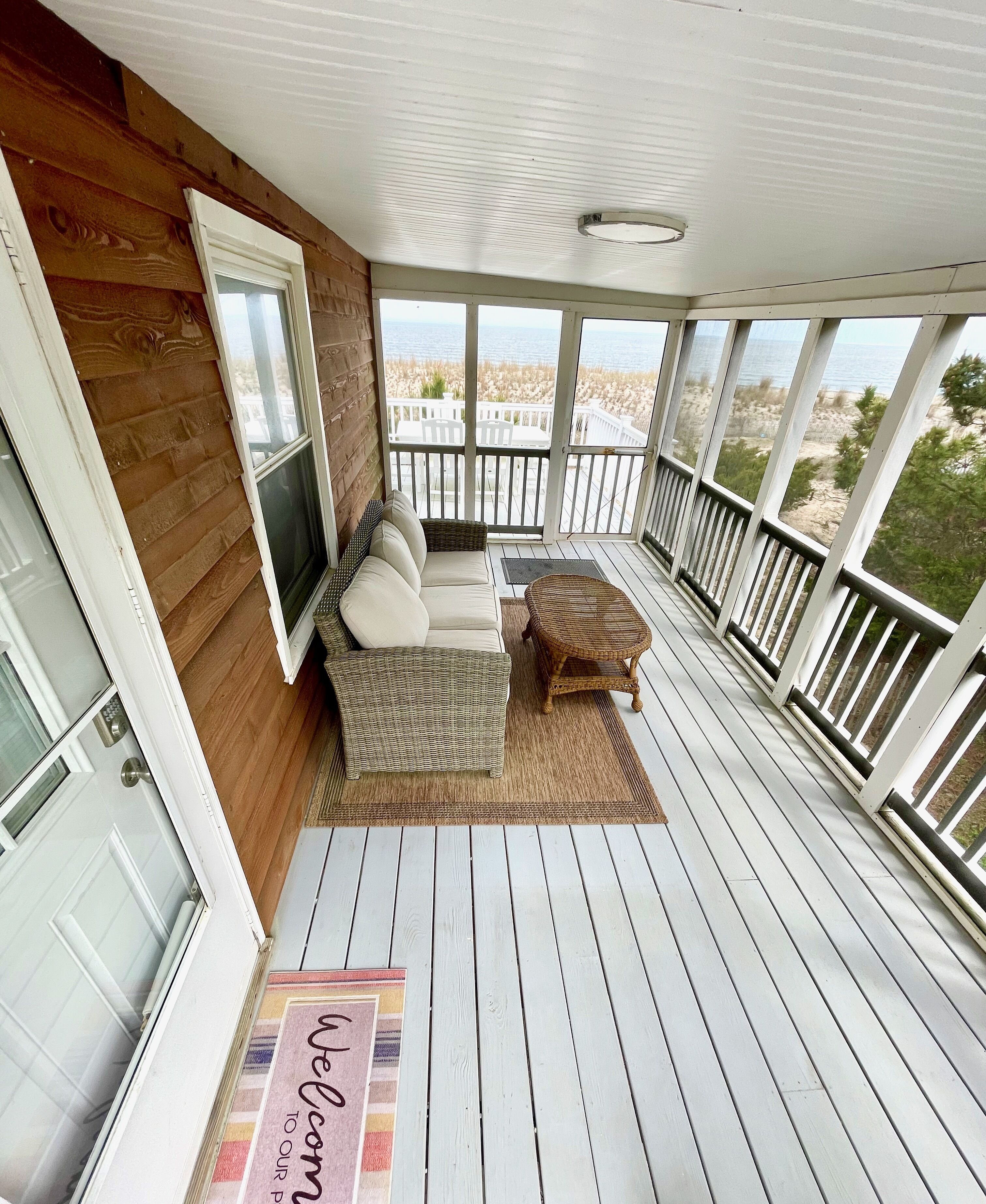 Screened-in porch in the morning. See the rays of sunlight passing through.
