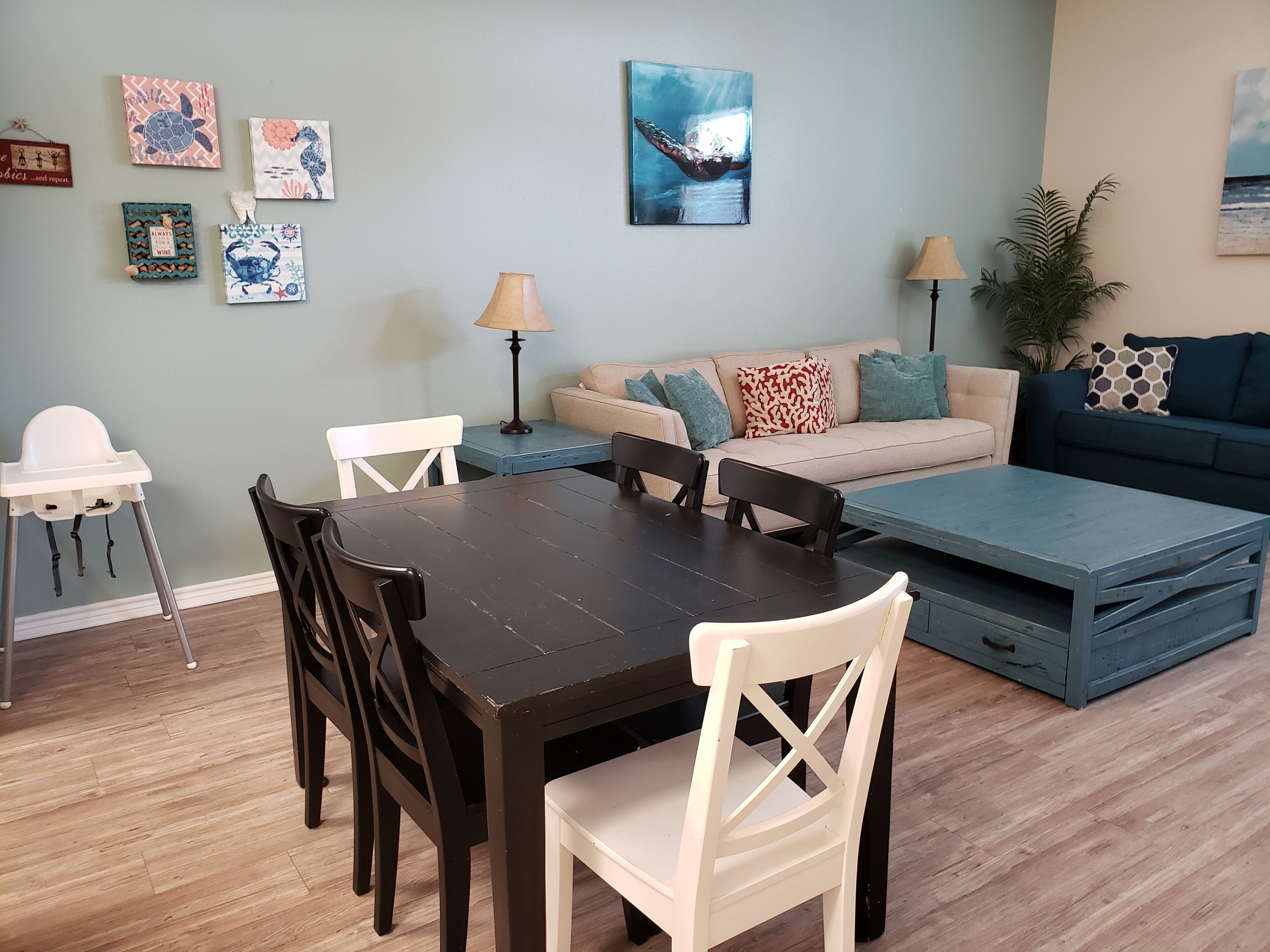 Dining table has seating for 6 plus a high chair for a little one. 