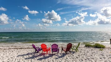 On the beach, sun loungers, beach towels