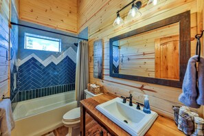 Combined shower/bathtub, hair dryer, towels, soap