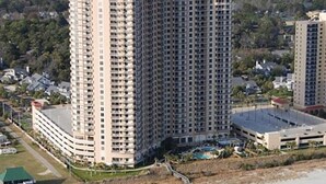 A high-rise hotel with multiple floors, a swimming pool, and a beach view. -  Beautiful Oceanview Margate. Book now for June and July (Myrtle Beach)