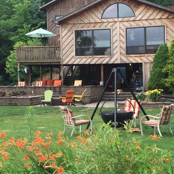 View of our lake house, with new wood burning, cowboy caldron