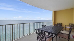 Outdoor dining - Emerald Isle 1309 - Front row beach chair service included! (Panama City Beach)