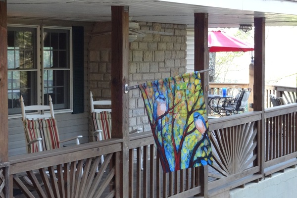 sit and rock on the covered deck or eat at 1 of 2 tables on the open deck