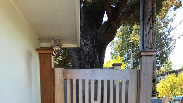 A wooden gate with vertical slats, a concrete base, and a metal latch. - DETACHED GUEST HOUSE: Walk To Town, 1030 Sq Ft, 1 BR/1.5 BA, Mt. Tam Vie (Mill Valley)