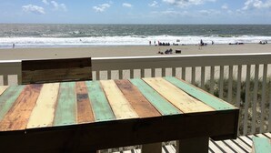 A wooden deck with a view of the beach and ocean. - Perfect in every Way: Nothing to do but relax (Kure Beach)