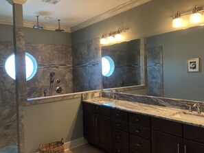 Combined shower/bathtub, towels, toilet paper