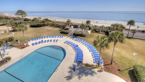 A pool area with blue lounge chairs and a clear view of the beach. - Beautiful Ocean Views, Beach Club 337! Steps to beach! (St. Simons Island)