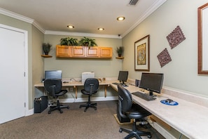 A home office with two desks, two chairs, a printer, and decorative plants. - Beautiful Ocean Views, Beach Club 337! Steps to beach! (St. Simons Island)