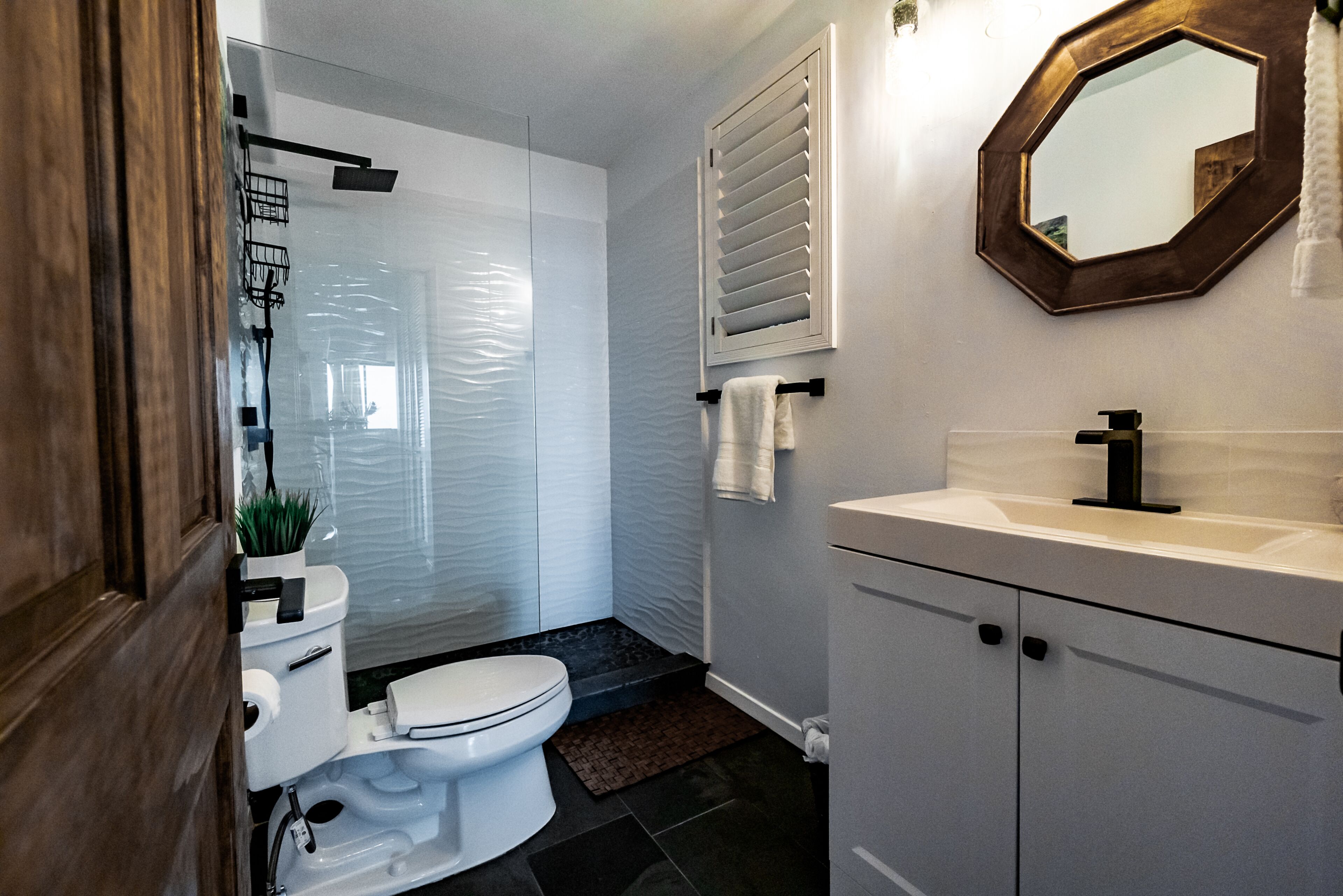 Shower, hair dryer, towels, toilet paper